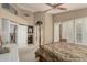 Bright main bedroom with sitting area and en-suite bath access at 13566 N 93Rd Pl, Scottsdale, AZ 85260