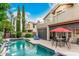 Beautiful pool area with covered patio, seating, and spa in a private backyard setting at 13566 N 93Rd Pl, Scottsdale, AZ 85260