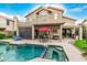 Stunning pool and spa area with covered patio and lush landscaping perfect for outdoor entertaining at 13566 N 93Rd Pl, Scottsdale, AZ 85260