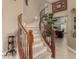 Elegant winding staircase with wood accents and iron railing at 13566 N 93Rd Pl, Scottsdale, AZ 85260