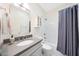 Bright bathroom with shower-tub combo, modern vanity, white subway tiles, and gray fixtures at 13584 N 102Nd Pl, Scottsdale, AZ 85260