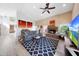 Spacious living room boasts a stone fireplace, vaulted ceilings, and stylish modern decor at 13584 N 102Nd Pl, Scottsdale, AZ 85260