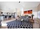 Open-concept living room flows into the kitchen with a cozy sofa and stylish decor at 13584 N 102Nd Pl, Scottsdale, AZ 85260
