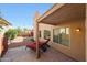 Relaxing covered patio with lounge chairs overlooking the private backyard at 13584 N 102Nd Pl, Scottsdale, AZ 85260