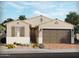 Charming single-story home with a two-car garage, desert landscaping, and neutral color palette at 137 N 175Th Ln, Goodyear, AZ 85338