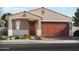 Charming single-story home with a well-manicured front yard and a spacious two-car garage at 149 N 175Th Ln, Goodyear, AZ 85338