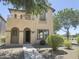 Charming two-story home featuring an inviting entryway and upper level balcony, perfect for enjoying neighborhood views at 1492 S Pike Ln, Gilbert, AZ 85296