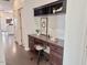 Hallway office featuring built-in shelves, wood floors, and neutral colors at 1492 S Pike Ln, Gilbert, AZ 85296
