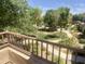 Community view from balcony shows mature trees, green grass, and landscaping at 1492 S Pike Ln, Gilbert, AZ 85296