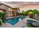 Expansive backyard with sparkling pool, hot tub, mature landscaping, and elegant architecture at 15237 S 19Th Way, Phoenix, AZ 85048