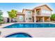 Backyard view featuring a large pool, covered patio, and desert-style landscaping at 15237 S 19Th Way, Phoenix, AZ 85048