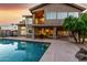 Gorgeous backyard featuring a pool, well-manicured landscaping, and an outdoor seating area at 15237 S 19Th Way, Phoenix, AZ 85048