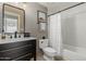 Cozy bathroom with tub, modern sink, and black fixtures at 15237 S 19Th Way, Phoenix, AZ 85048