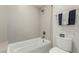 Bright bathroom featuring tiled shower-over-tub, neutral colors and chrome hardware at 15237 S 19Th Way, Phoenix, AZ 85048