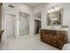 This bathroom features a stand-up shower, tiled floors, and a vanity with marble countertop at 15237 S 19Th Way, Phoenix, AZ 85048