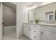 The bathroom has a double sink vanity, tiled floors, and a bathtub with shower at 15237 S 19Th Way, Phoenix, AZ 85048