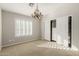 A bright bedroom features shuttered windows, carpet flooring, and a closet with sliding doors at 15237 S 19Th Way, Phoenix, AZ 85048