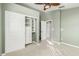 Bedroom features closet, neutral walls, ceiling fan, carpet, and white doors leading to other rooms at 15237 S 19Th Way, Phoenix, AZ 85048
