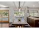 Dining area featuring bench seating, modern light fixture, and view of the backyard at 15237 S 19Th Way, Phoenix, AZ 85048