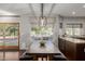 Dining area featuring long table, bench seating, and natural light at 15237 S 19Th Way, Phoenix, AZ 85048