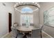 Dining room with a chandelier, plantation shutters and seating for six at 15237 S 19Th Way, Phoenix, AZ 85048