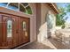 Detailed double front doors with leaded glass, arched windows and brick paver flooring at 15237 S 19Th Way, Phoenix, AZ 85048