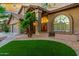 Inviting home featuring manicured front lawn, desert landscaping and covered entryway at 15237 S 19Th Way, Phoenix, AZ 85048