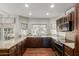 Bright kitchen with granite countertops, stainless appliances, dark wood cabinets, and tile backsplash at 15237 S 19Th Way, Phoenix, AZ 85048