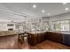 Modern kitchen featuring hardwood floors, granite countertops, stainless steel appliances, and natural light at 15237 S 19Th Way, Phoenix, AZ 85048