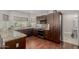 Gourmet kitchen with granite countertops, stainless steel appliances, and dark wood cabinetry at 15237 S 19Th Way, Phoenix, AZ 85048