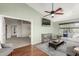 The cozy living room features hardwood floors, a ceiling fan, and an open floor plan at 15237 S 19Th Way, Phoenix, AZ 85048
