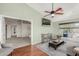 Cozy living room boasts vaulted ceilings, ceiling fan, and a large TV for relaxing and entertaining at 15237 S 19Th Way, Phoenix, AZ 85048