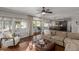 Open-concept living room featuring natural light, hardwood floors, and neutral decor at 15237 S 19Th Way, Phoenix, AZ 85048