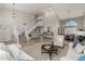 Bright living room with a staircase, cathedral ceiling, and access to dining area at 15237 S 19Th Way, Phoenix, AZ 85048