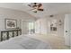 A bright main bedroom boasts private balcony access and a view of the en-suite bathroom at 15237 S 19Th Way, Phoenix, AZ 85048