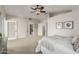 Spacious main bedroom with a ceiling fan, walk-in closet, and entry to the en-suite bathroom at 15237 S 19Th Way, Phoenix, AZ 85048
