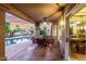 Inviting covered patio offers dining space overlooking the pool and manicured backyard at 15237 S 19Th Way, Phoenix, AZ 85048