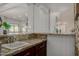 Stylish wet bar area with granite countertops, a sink, and modern finishes at 15237 S 19Th Way, Phoenix, AZ 85048