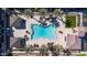 Overhead view of pool with lounge seating, umbrellas, and palm trees in a stylish setting at 155 N Lakeview Blvd # 268, Chandler, AZ 85225