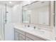 Modern bathroom featuring glass shower, double sinks and large mirror at 155 N Lakeview Blvd # 268, Chandler, AZ 85225