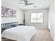 Spacious bedroom with neutral tones, ceiling fan and comfortable bedding at 155 N Lakeview Blvd # 268, Chandler, AZ 85225