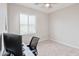 Bright bedroom with neutral carpet, a ceiling fan, and a large window offering natural light at 155 N Lakeview Blvd # 268, Chandler, AZ 85225