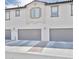 Modern townhome showcasing a clean facade with private garage spaces at 155 N Lakeview Blvd # 268, Chandler, AZ 85225