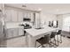 Bright kitchen featuring stainless steel appliances, white cabinets, and a quartz countertop island at 155 N Lakeview Blvd # 268, Chandler, AZ 85225