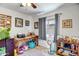Bright bedroom with a ceiling fan, natural light, and a cozy atmosphere perfect for relaxation and rest at 15558 N Ulrich Way, Surprise, AZ 85374