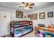 Cozy bedroom with a bunk bed, workspace, and playful decor for a sanctuary of imagination at 15558 N Ulrich Way, Surprise, AZ 85374
