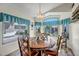 Cozy breakfast nook with large windows and a decorative chandelier at 15558 N Ulrich Way, Surprise, AZ 85374