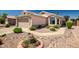 Lovely front exterior of home showcasing desert landscaping and a charming facade at 15558 N Ulrich Way, Surprise, AZ 85374
