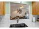 View from the kitchen into the living room, offering an open concept layout at 15558 N Ulrich Way, Surprise, AZ 85374