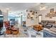 Cozy living room with hardwood floors, neutral tones, and an adjoining dining area at 15558 N Ulrich Way, Surprise, AZ 85374